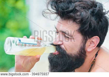 Bearded Man Drink Alcohol.man With Long Beard Hold Beer. Brutal Man With Beard. Hispter Style. Alcoh