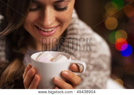 Happy Young Woman Holding Cup Of Hot Chocolate With Marshmallow