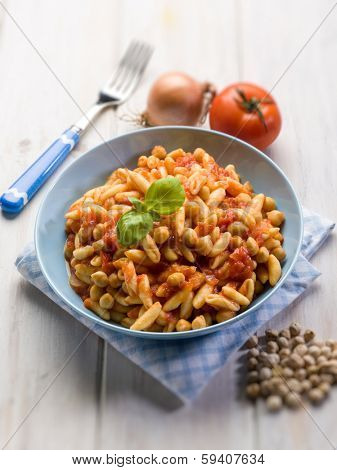pasta cavatelli with chickpeas and tomatoes, selective focus