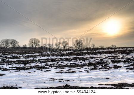 Sunrise Over Barren Field