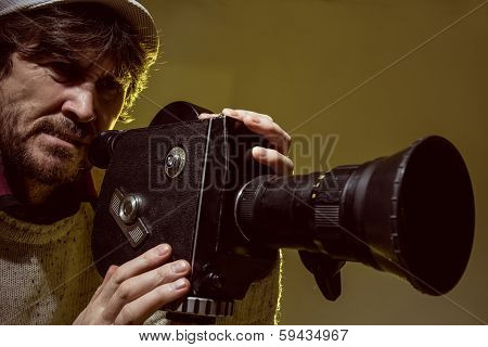 Man With Old Film Movie Camera. Shooting Of The Film