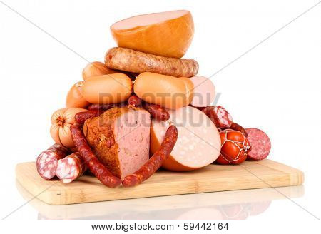 Lot of different sausages on wooden board isolated on white