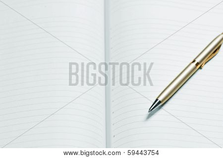 pen and open notepad