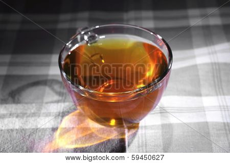 cream cheese schnitt layer cake with tea and red fresh sweet grapes on wood background