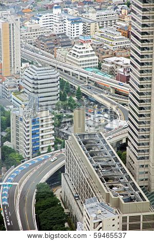 Industrial View Of Tokyo With Busy Roads And Skyscrapers