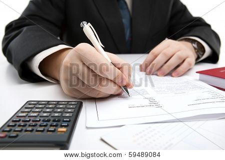 Man Signing A Contract