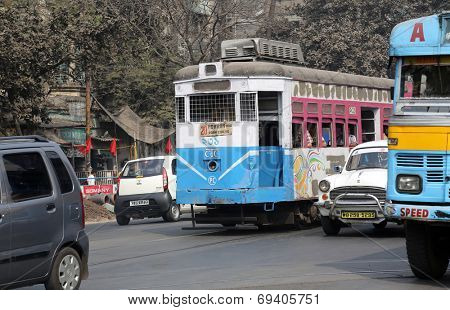 KOLKATA, INDIA - FEB 08: Traditional tram downtown Kolkata on February 08, 2014. Kolkata is the only Indian city with a tram network, which is operated by the Calcutta Tramways Comp.