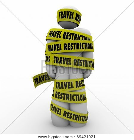 Man wrapped in yellow tape reading Travel Restrictions warning of dangers or risks in visiting hazardous areas