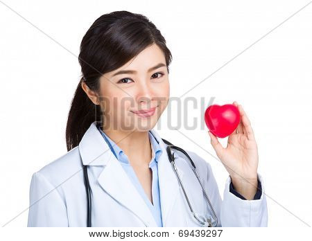 Medical female doctor with heart shape ball
