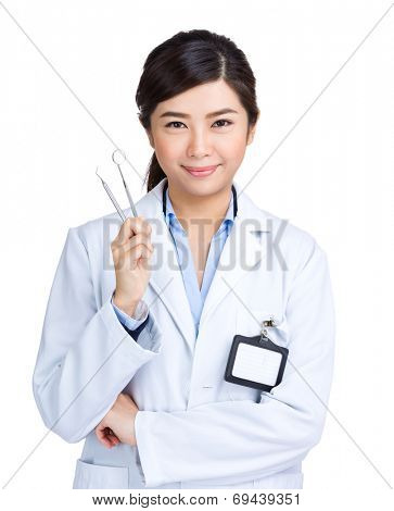 Female dentist hold mirror and probe