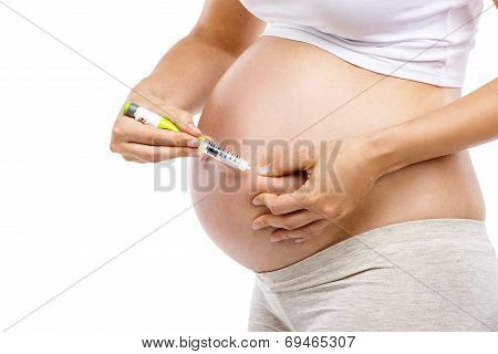Pregnant woman with syringe