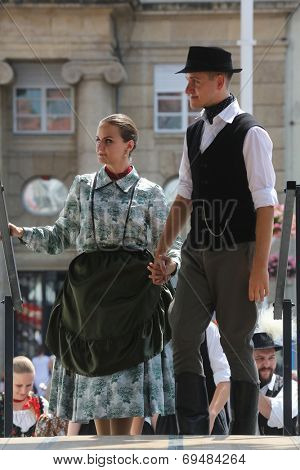 ZAGREB, CROATIA - JULY 19: Members of folk groups Nograd  from Salgotarjan, Hungary during the 48th International Folklore Festival in center of Zagreb, Croatia on July 19, 2014
