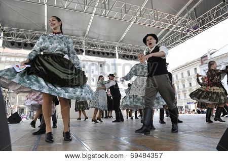 ZAGREB, CROATIA - JULY 19: Members of folk groups Nograd  from Salgotarjan, Hungary during the 48th International Folklore Festival in center of Zagreb, Croatia on July 19, 2014