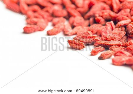 dried goji berries on white background