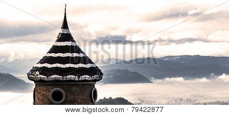 Tower in the valley of fog