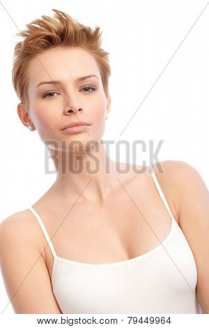 Beauty shot of young attractive woman with trendy short hair.