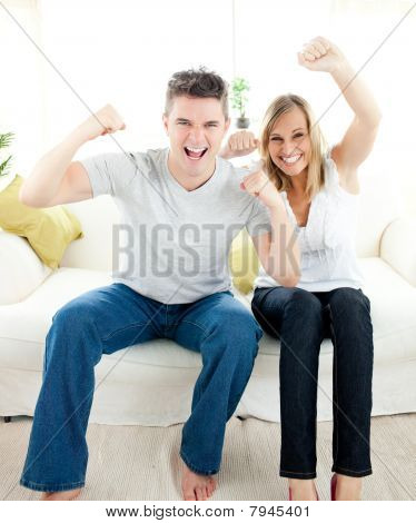 Charming Couple Punching The Air