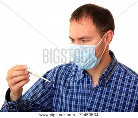 Man in medical mask with a thermometer.