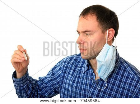 Man in a medical mask with a thermometer.