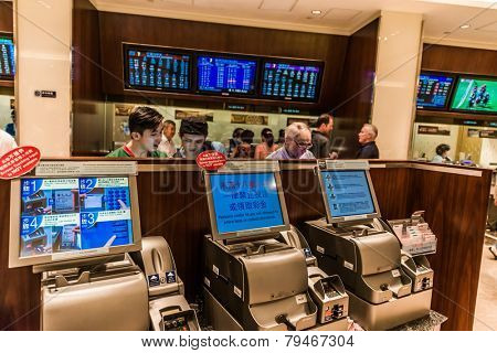 Happy Valley, Hong Kong, China- June 5, 2014: people betting horse races at Happy Valley racecourse