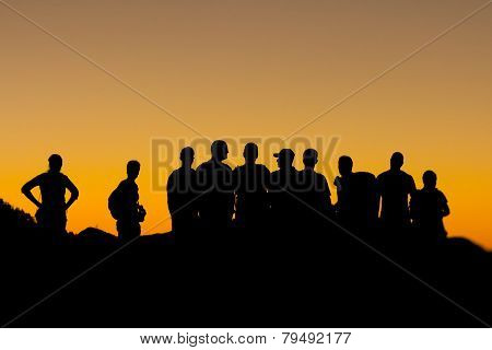People Silhouettes At Sunset
