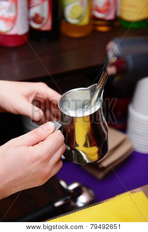 Woman preparing coffee, close up