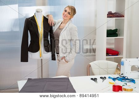 Fashion Designer With Dressmakers Model