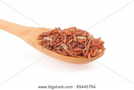 Red Rice In A Wooden Spoo
