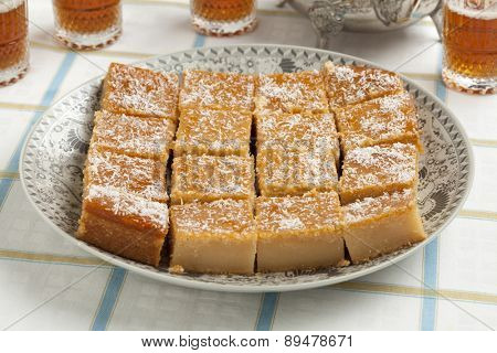  Fresh baked Moroccan yogurt cake cut into pieces and tea for visitors