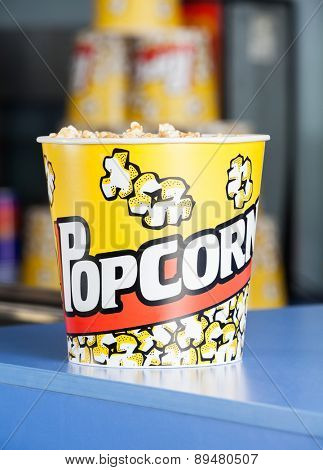 Bucket of popcorn on cinema concession counter