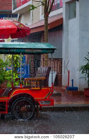 Tuktuk motocycle during rain monsoon in Kampot