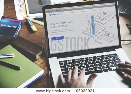 Bangkok, Thailand - October 14, 2015: Man on a Computer Browsing Dropbox Website