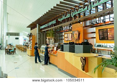 DUBAI - APRIL 18, 2014: Starbucks cafe. Starbucks locations serve hot and cold beverages, whole-bean coffee, microground instant coffee, espresso, caffe latte, full-leaf teas, pastries, and snacks