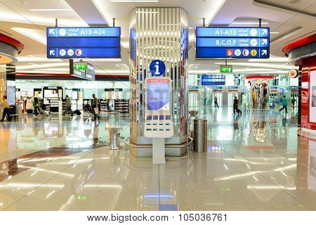 DUBAI, UAE - APRIL 18, 2014: the interior of Concourse A. The concourse includes one 4 star hotel and one 5 star hotel, first and business class lounges, and duty-free areas
