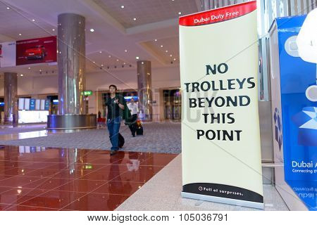 DUBAI, UAE - APRIL 18, 2014: the interior of Concourse A. The concourse includes one 4 star hotel and one 5 star hotel, first and business class lounges, and duty-free areas