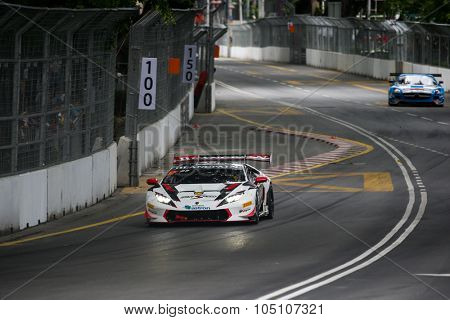 KUALA LUMPUR, MALAYSIA - AUGUST 08, 2015: Afiq Yazid of Malaysia drives a Lamborghini Huracan Super Trofeo LP620 car takes turn 2 in the KL City GT CUP Race of the 2015 Kuala Lumpur City Grand Prix.
