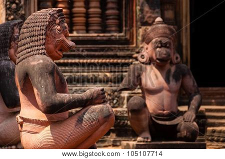 Stone sculputure sitting in front of temple B
