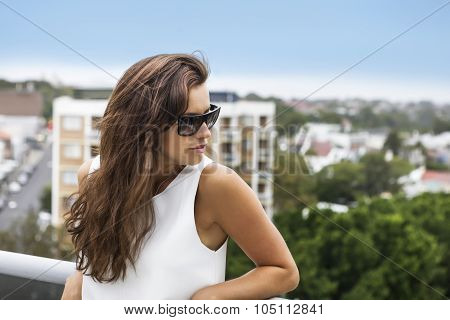 Beautiful Woman Standing In A Terrace