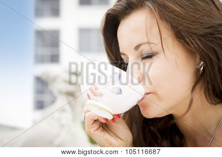 Beautiful Woman Enjoying A Cup Of Tea