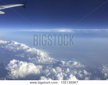 Aircraft Wing Above Clouds