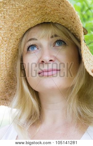 European Blond Woman In Straw Hat