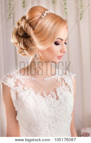 Portrait of Beautiful Bride. Beautiful bride in a wedding-dress is in fashion style. Wedding decorat