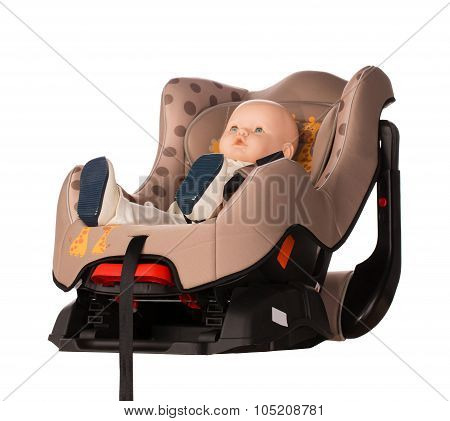 Baby doll in a booster seat for a car