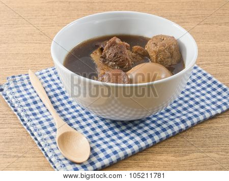 White Bowl Of Five Spice Stew With Egg, Tofu And Pork