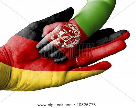 Adult Man Holding A Baby Hand With Germany And Afghanistan Flags Overlaid. Isolated On White