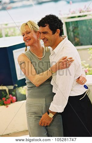 CANNES, FRANCE - MAY 25: Antonio Banderas and Melanie Griffith attand the photocall for the film 'Femme fatale' at the palais des festivals during the 55th Cannes film festival 25 May, 2002 in Cannes, France