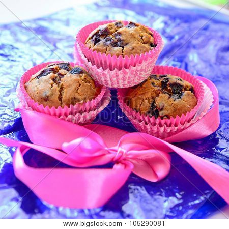 Blueberry cupcakes on blue paper