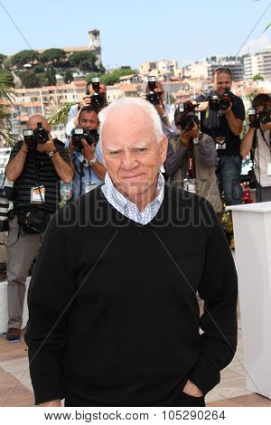 CANNES, FRANCE - MAY 20: Actor Malcolm McDowell attends the 'Le Lechon De Cinema: Malcom McDowell' photocall during the 64 Cannes  Festival at Palais des Festivals on May 20, 2011 in Cannes, France.
