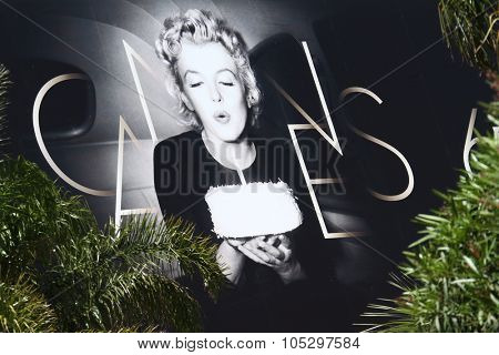 CANNES, FRANCE - MAY 17: Palais des Festivals facade shown and the official poster 65th Annual Cannes Film Festival at Palais des Festivals on May 17, 2012 in Cannes, France.