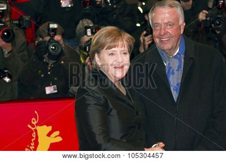 BERLIN, GERMANY - FEBRUARY 13: German Chancellor Angela Merkel  and Bernd Neumann attend the 'Pina' Premiere during of the 61st Berlin Film Festival at Palace on February 13, 2011 in Berlin, Germany